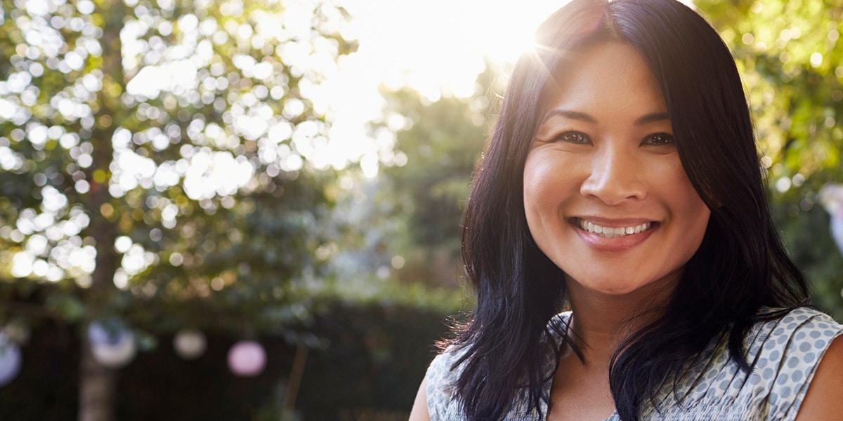 Woman Smiling In Yard
